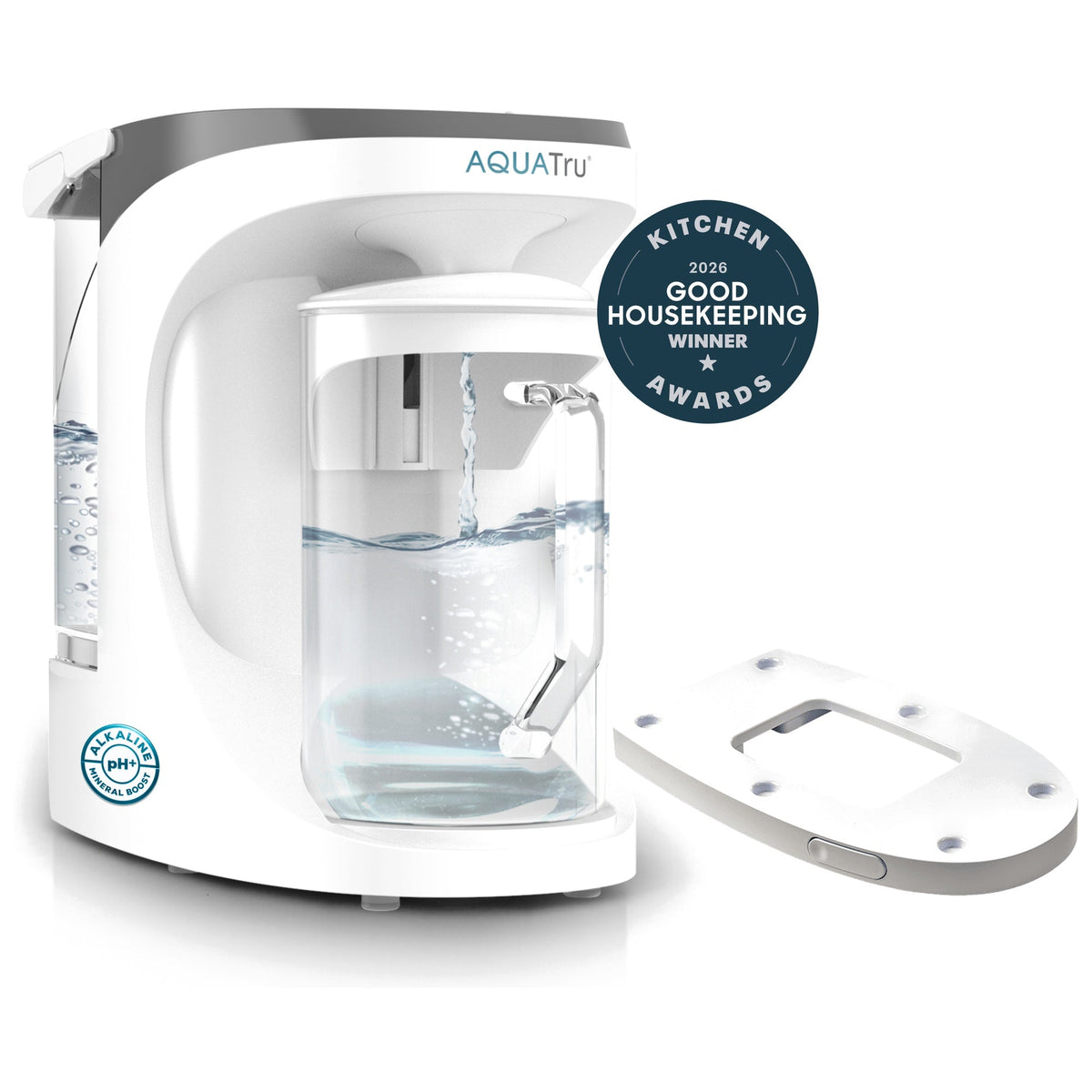 AquaTru carafe with water pouring, accompanied by a sliding tray and award badge for Good Housekeeping 2026.