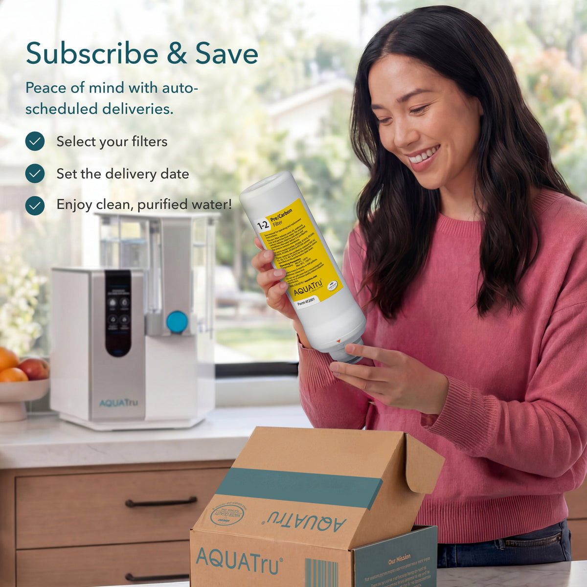 Woman smiling while holding a water filter bottle next to a water purifier and an open delivery box.