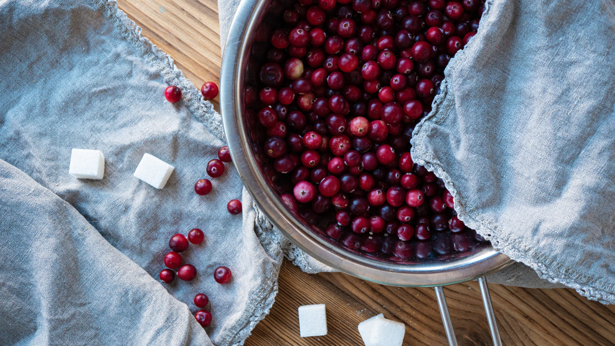 Cranberries in strainer on a table