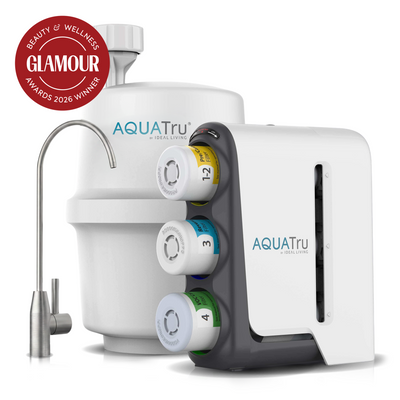 AquaTru under sink water filter with a stainless steel faucet and a Glamour Beauty & Wellness Awards 2026 Winner badge.