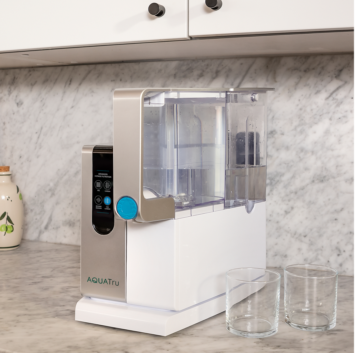 AquaTru Classic water purifier with free pre-carbon filter, sleek design on a marble countertop.