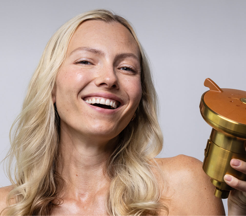 woman with AQT showerhead