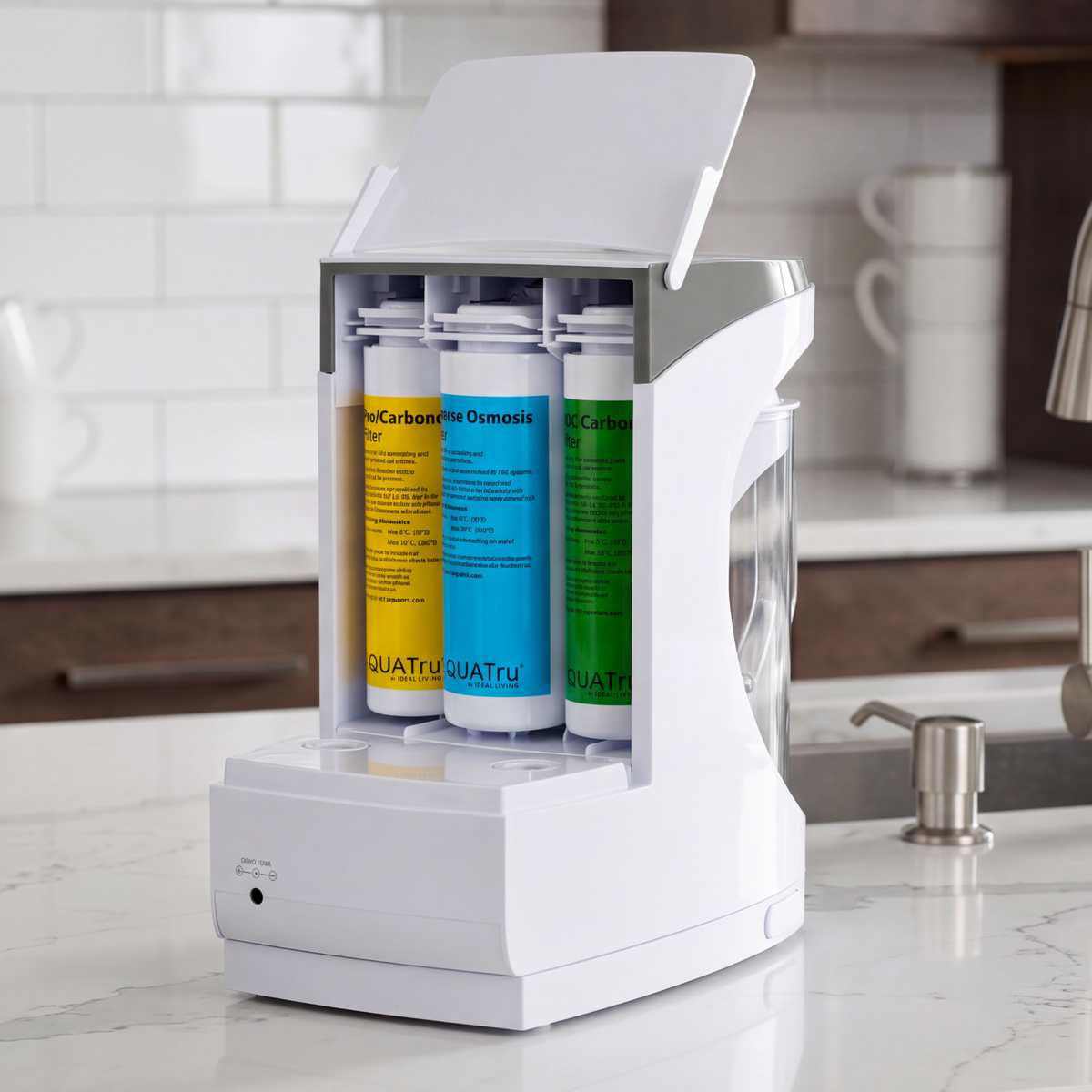 Water filtration system with three colorful replacement filters in a sleek white dispenser on a kitchen countertop.