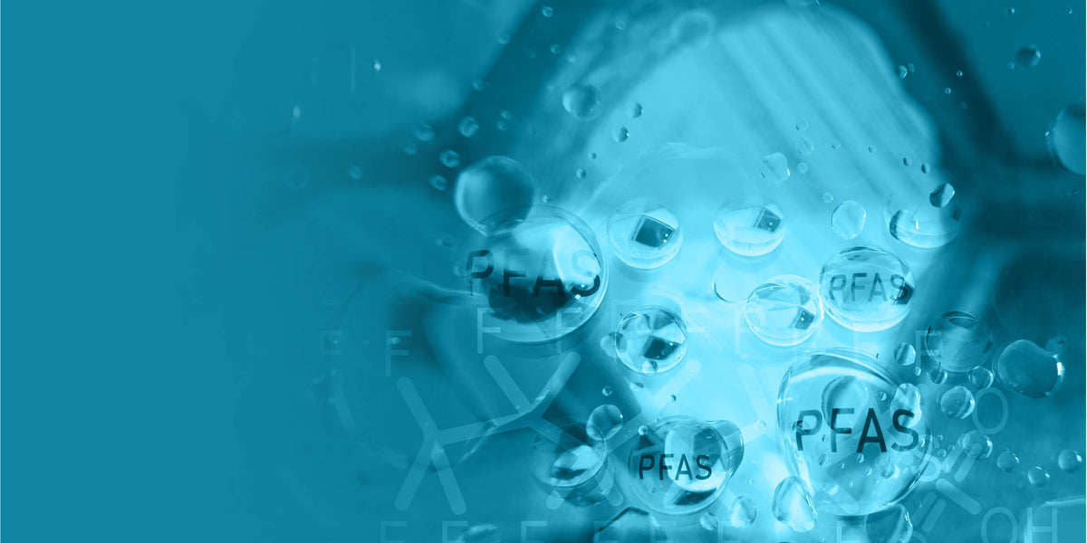 Droplets with "PFAS" text on a blue background, representing chemical compounds and environmental concerns.