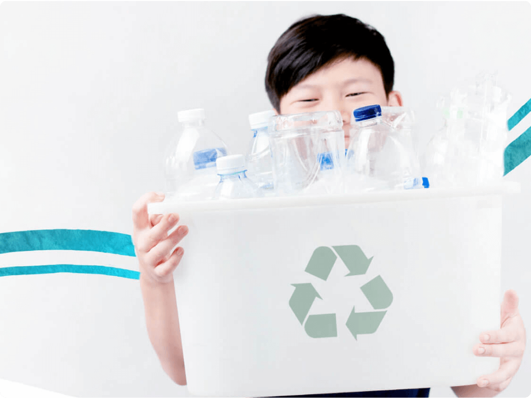 Child holding a container filled with plastic bottles, featuring a recycling symbol on the front.