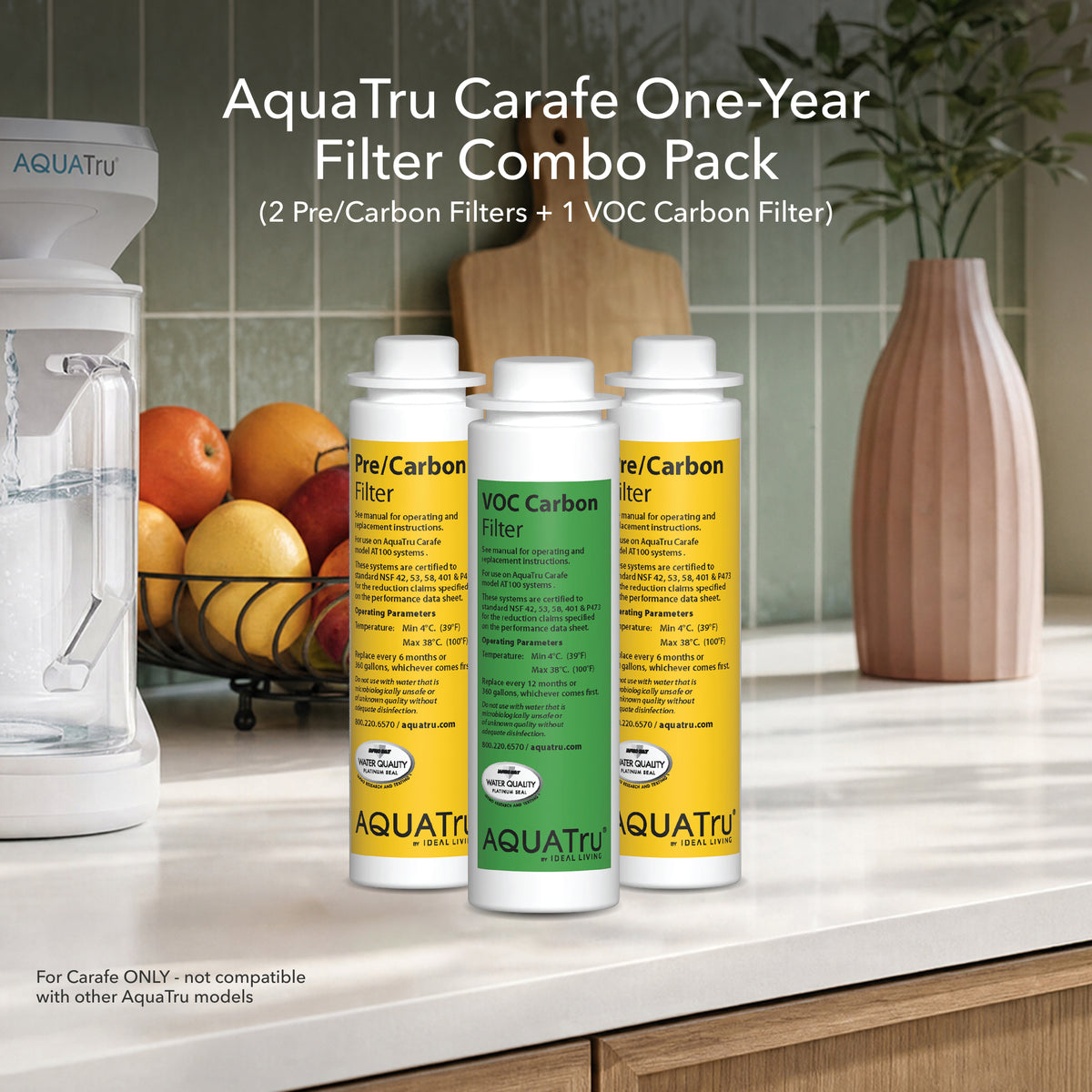 AquaTru carafe one-year filter combo pack with two pre/carbon filters and one VOC carbon filter on a kitchen countertop.