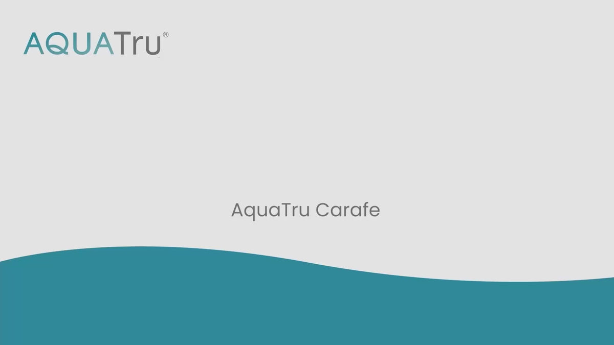 Load video: Video showing the process of changing the filters on an AquaTru Carafe water purifier. 